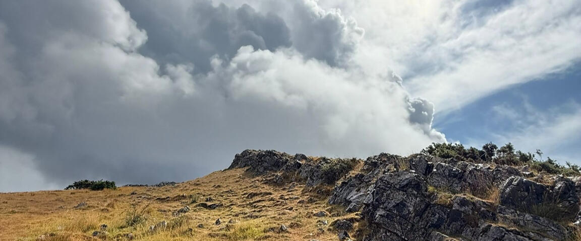 Crook Peak, Somerset Photograph of Crook Peak, Somerset, showing craggy rocks and a stormy sky